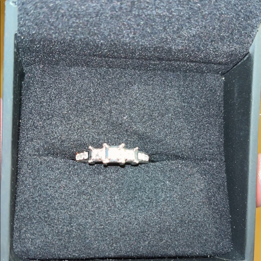 14K White gold band 1/4 karat diamond weight. Signet.